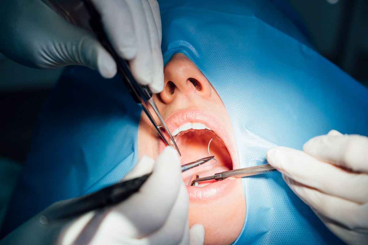 dentist working in his office with a patient