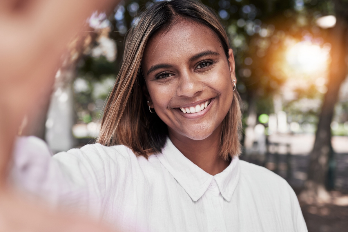 Woman with a confident smile reflecting successful cosmetic dental results